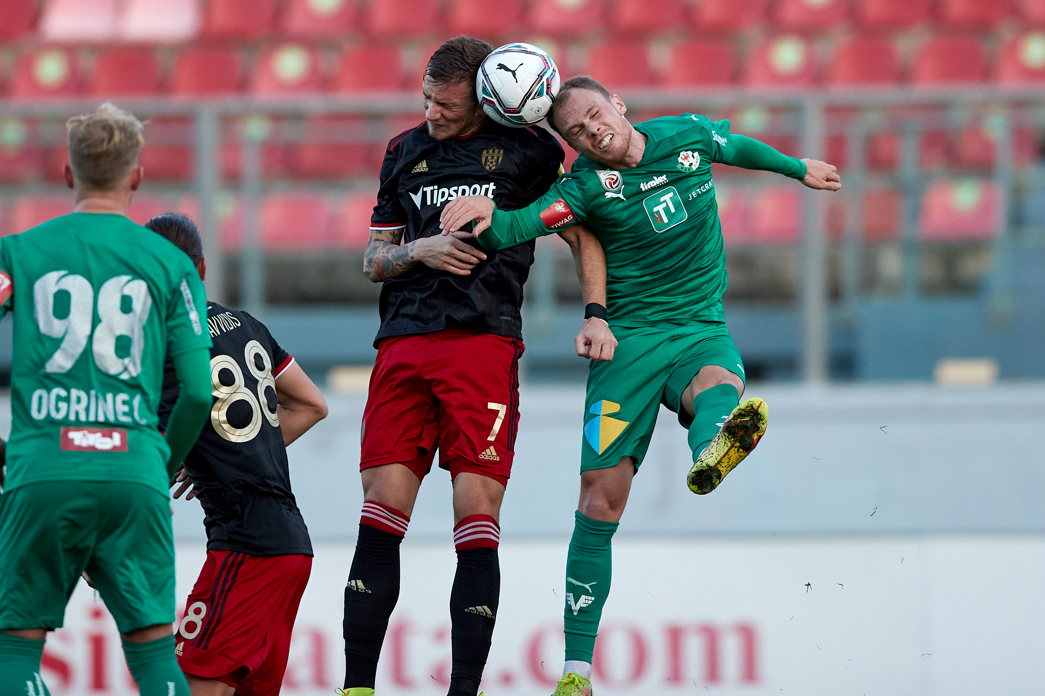 IMAGO / Domenic Aquilina | Milan Ristovski (L) captain of Spartak Trnava vies for the ball with Renny Smith (R) of WSG Tirol during the inaugural tournament on 18 January 2022 played in brilliant weather.