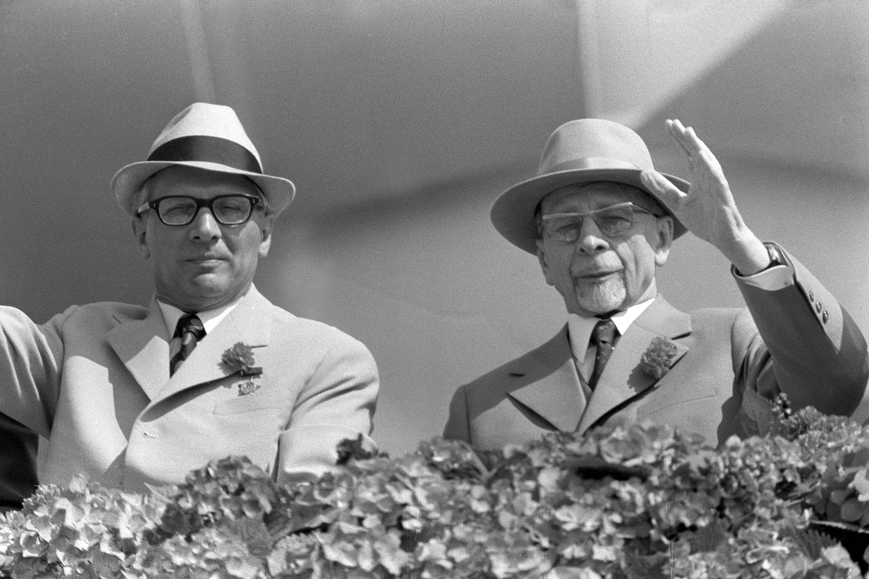 IMAGO / Sven Simon | Erich Honecker (left) and Walter Ulbricht (right) wave from the stands to people in the first of May parade, May Day in Berlin. 1 May 1972, Berlin.