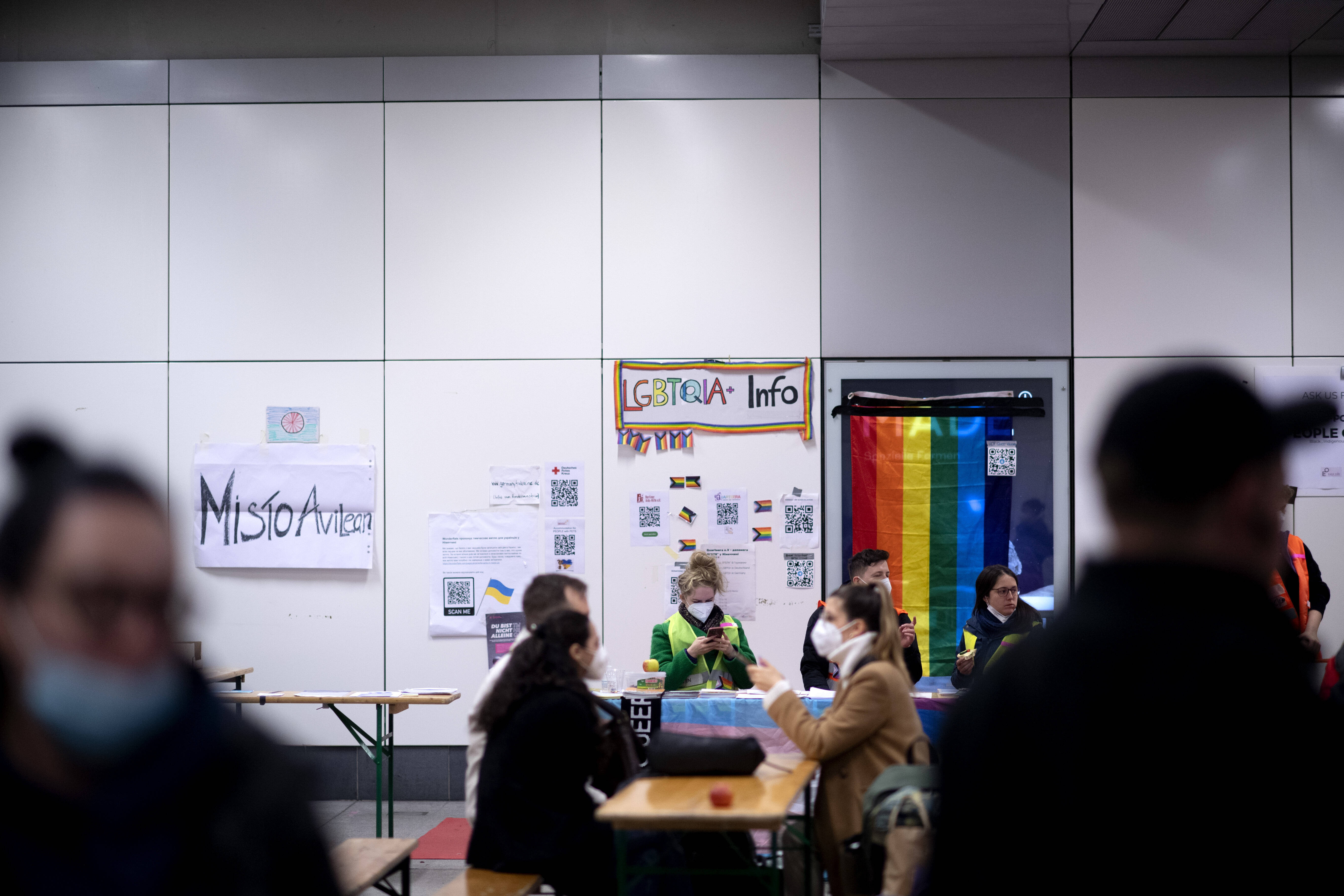 IMAGO / IPON | LGBTQIA information desk at the arrivals center. Ukrainian refugees disembark a train from Poland after arriving at Hauptbahnhof in Berlin.